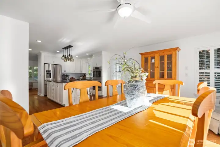 View from the dining room into the kitchen, dappled sunlight fills this space making it the perfect location to enjoy your morning coffee or evening beverage.