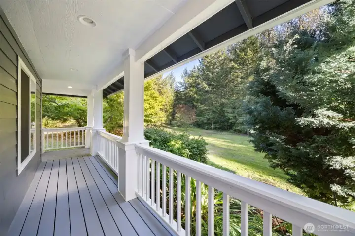 The covered wrap-around porch is the space of dreams, offering covered lookout onto your gorgeous property. The leaves are just beginning to change, offering an ever changing visual landscape.