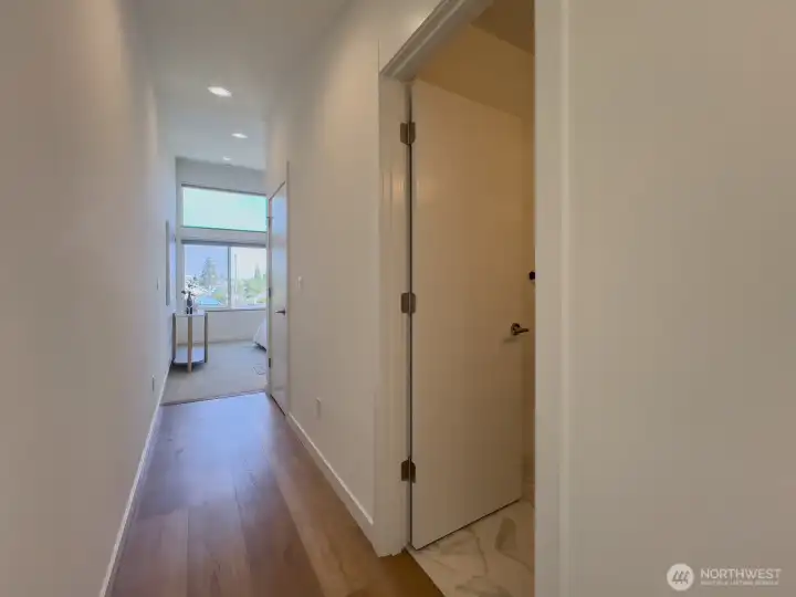 Laundry and bath tucked around the corner from bedroom