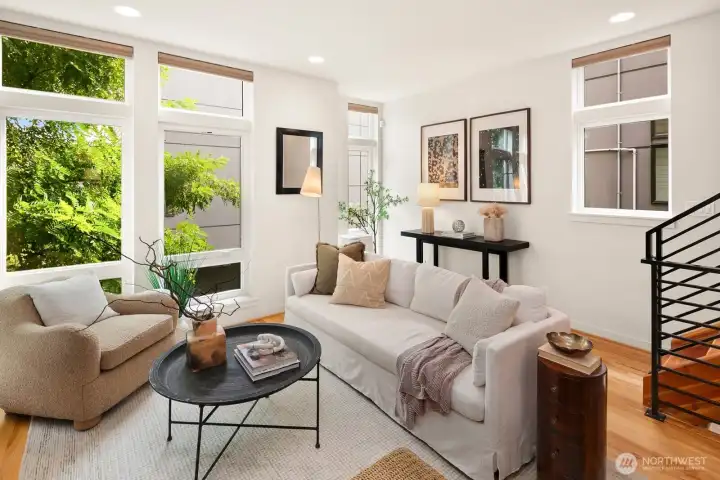 Open concept living/dining/kitchen w/ gas fireplace & floor to ceiling windows