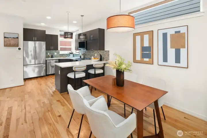 Open concept living/dining/kitchen w/ gas fireplace & floor to ceiling windows