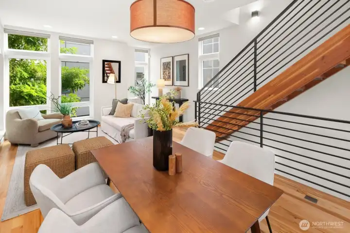 Open concept living/dining/kitchen w/ gas fireplace & floor to ceiling windows