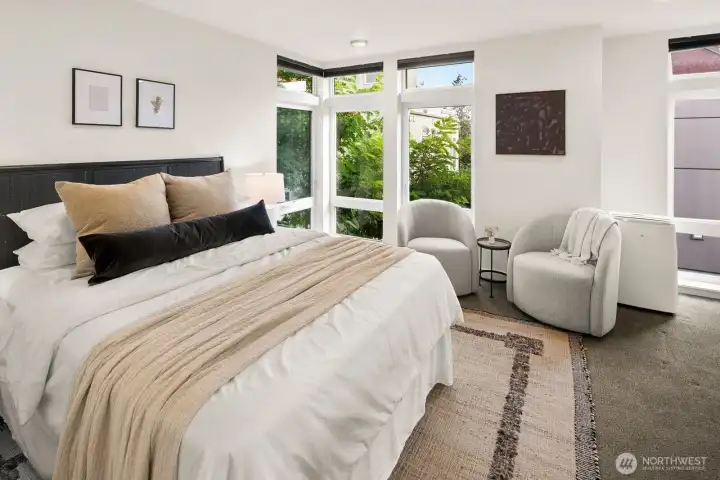 Upper level primary suite w/ walk-in closet & expansive en-suite bath