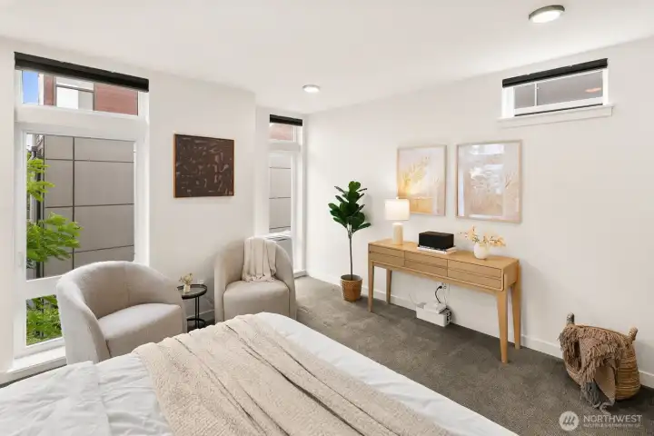 Upper level primary suite w/ walk-in closet & expansive en-suite bath