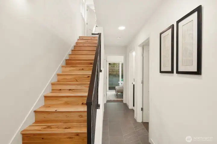 Entry hallway leading to additional bedrooms & backyard access