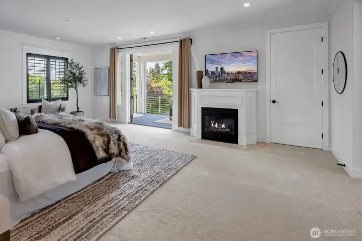 Owner's retreat with a spa-inspired bath, spacious walk-in closet and a cozy gas fireplace for added ambiance. Enjoy sunsets from the serene view deck.