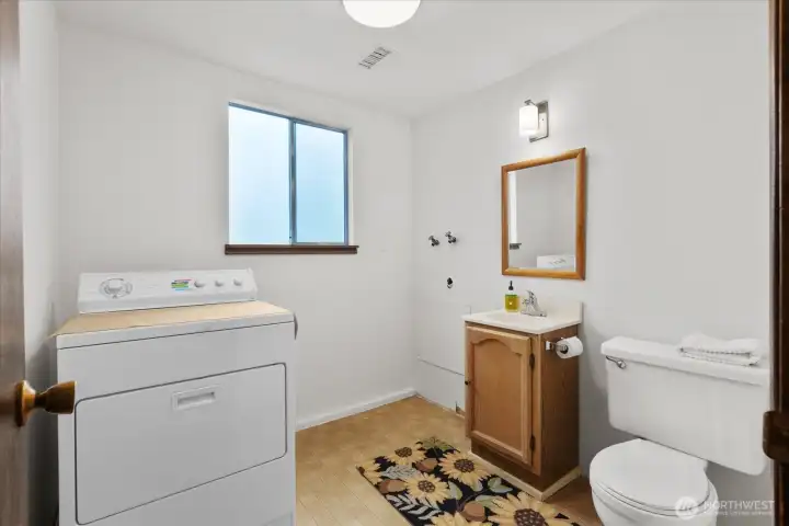 Lower level half bath with laundry.