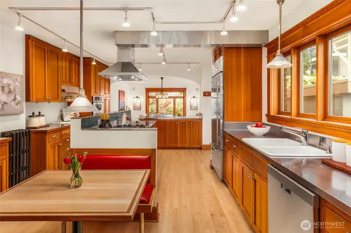 Showstopping chef’s kitchen with stainless steel counters and custom cabinetry