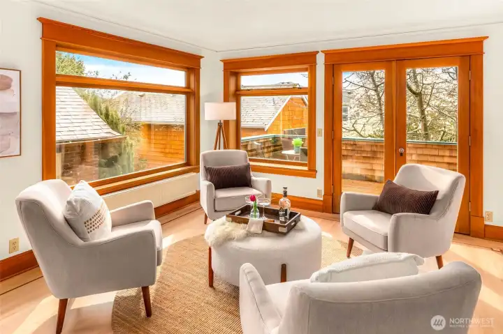 Living room sitting area with access to sun-filled deck