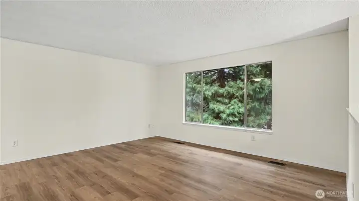 Upstairs living room filled with natural light, perfect for relaxing or entertaining.