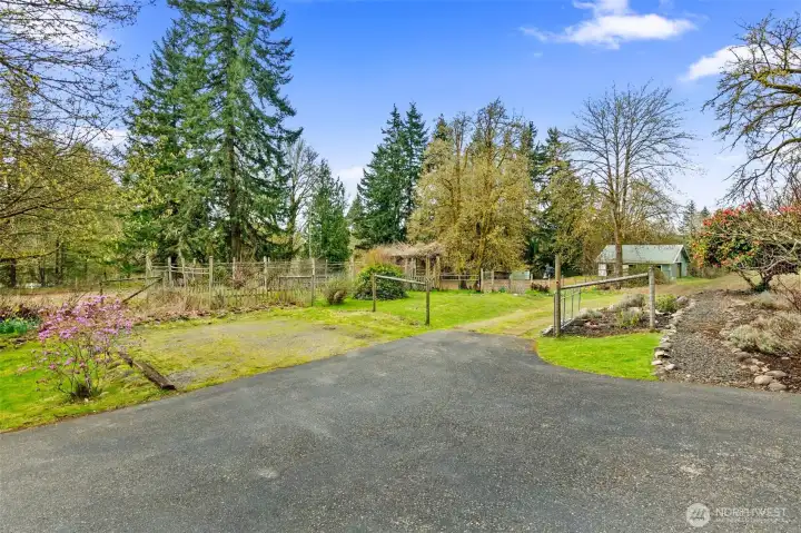 Extra parking, mature and flowering landscaping everywhere, and a mud-free driveway back to the barn