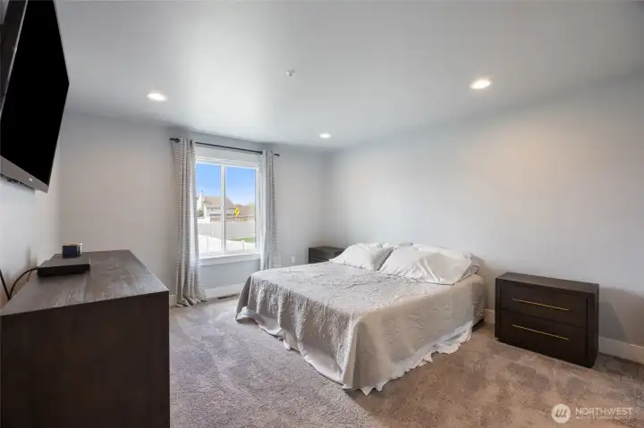 Main level primary suite with large windows