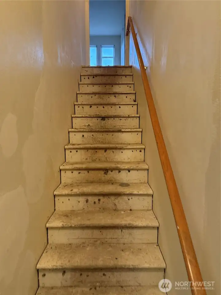 Stairs to loft, 2 bedrooms & unfinished bath