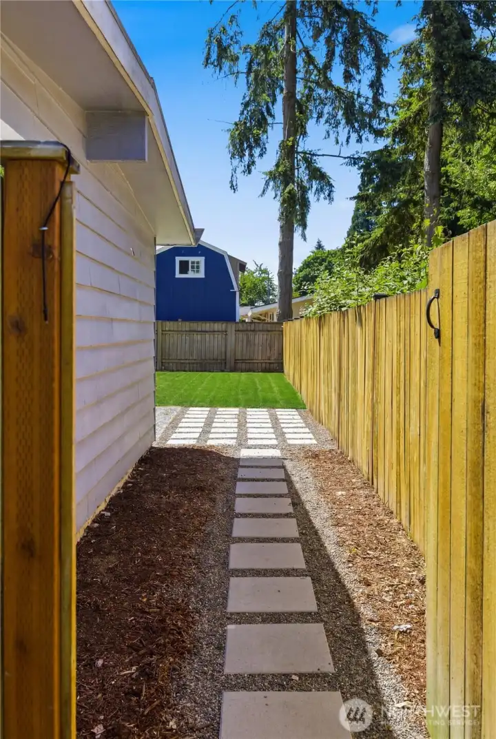 Access the backyard easily with gates on either side of the home.