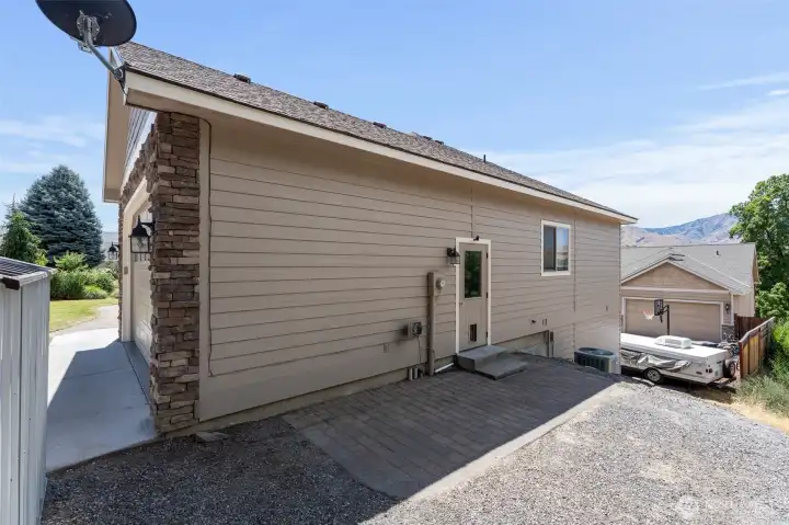 Side of home- with paver patio area