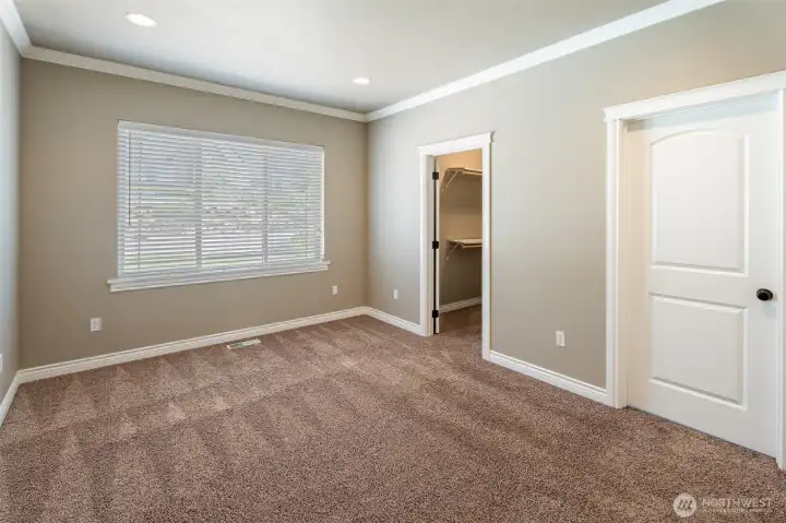 primary on main floor with walk in closet and private bath