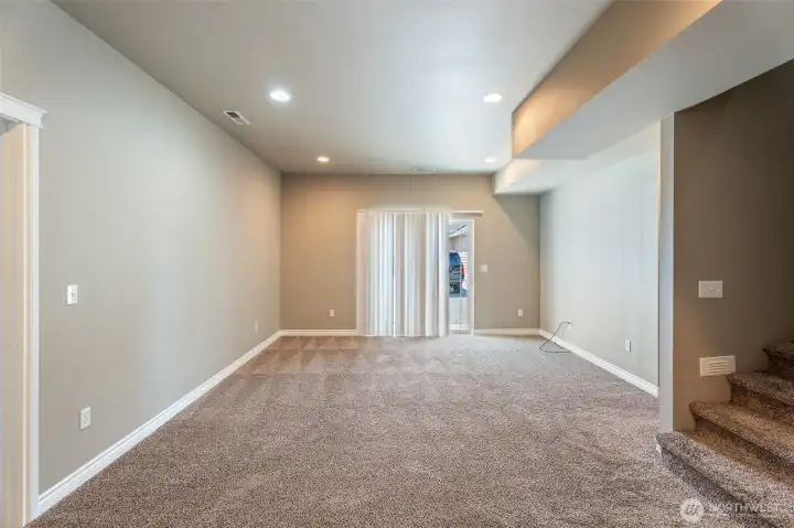 Family room on lower level with slider
