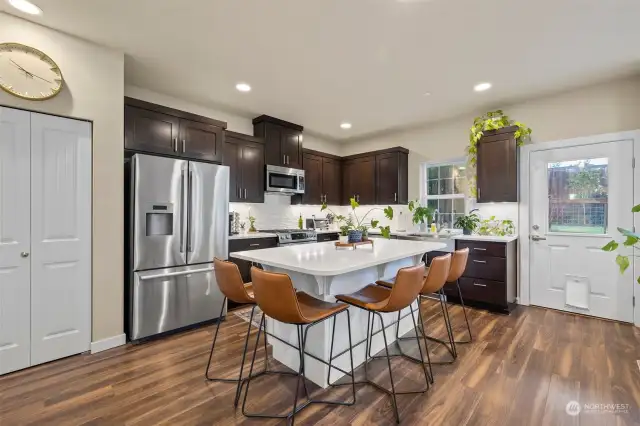 Designated pantry to store goods or kitchen gadgets.