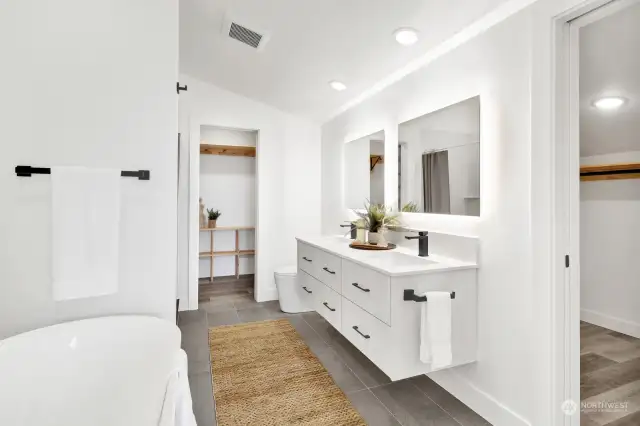 Beautiful primary bath,features free standing tub,quartz shower & two closets.