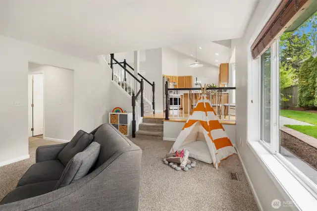 One of the best rooms in the home w/cozy gas fireplace and just so beautiful in size. Backs to the private and fully fenced back yard w/green surround. This home lives perfectly.