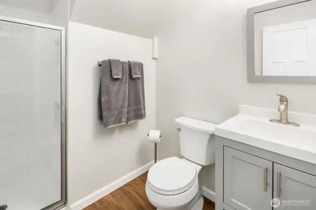 The new, Pottery barn inspired 3/4 bath is adjacent to the lower level 4th bedroom, office...or home gym w/slider to the patio + wonderful yard.