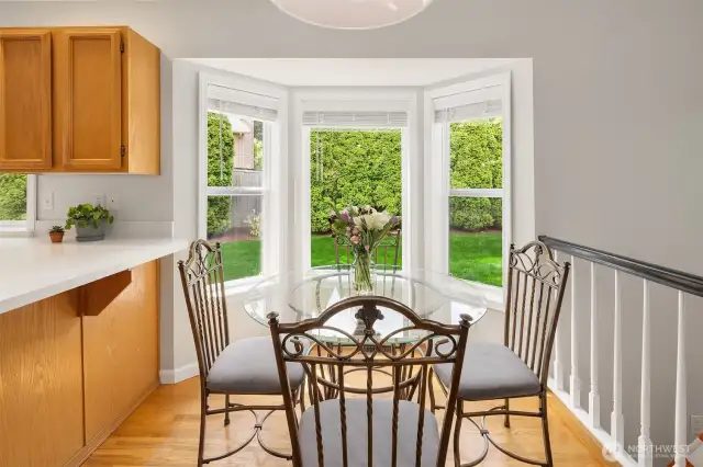Private. Green surround....the perfect in kitchen dining space. The flow of the home is open...bright and move in ready.