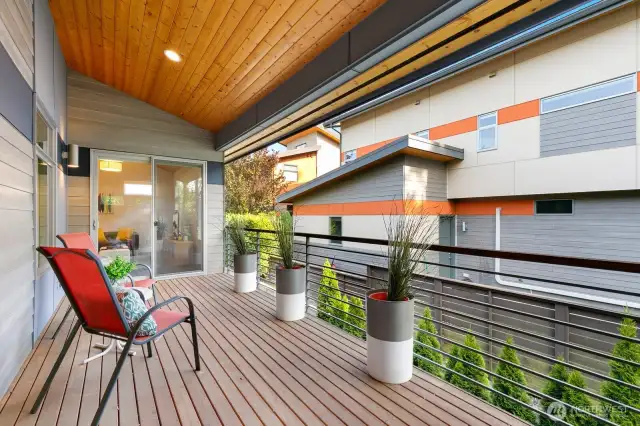 Covered deck has access to primary bedroom, as well as the loft straight ahead