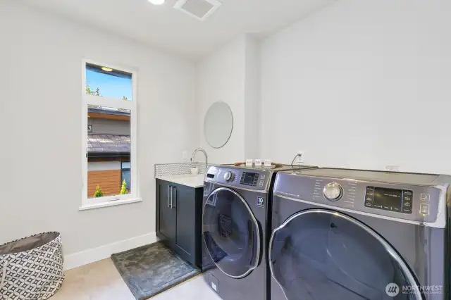 Oversized laundry room upstairs; storage closet not pictured, but lots of storage