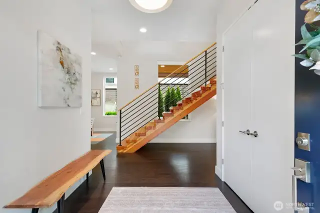 A welcoming hallway with view to the gorgeous open staircase