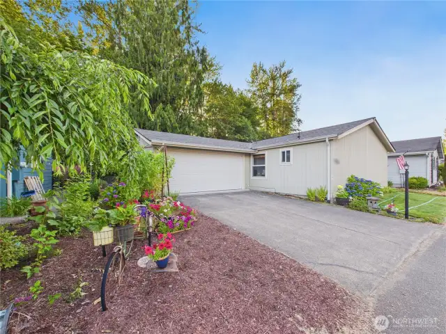 This lovingly maintained home is waiting for its new owner. Prettily landscaped yard.