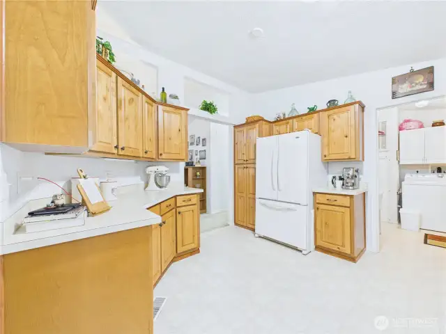 This spacious kitchen has lots of storage and work spaces.