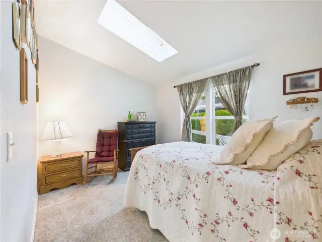 Bedroom #1. Light and bright with the skylight letting in natural light.