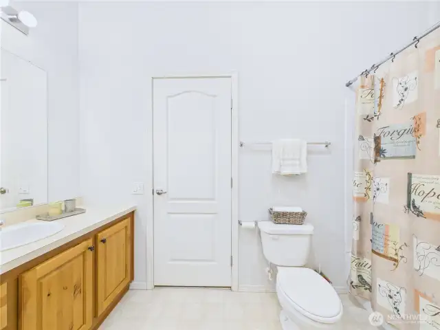 The full guest bathroom is conveniently located in the middle of the home.