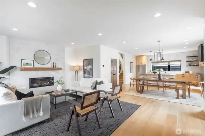 Comfortable living room complete with custom mantle-piece and convenient gas fireplace. LED lighting. New interior paint.