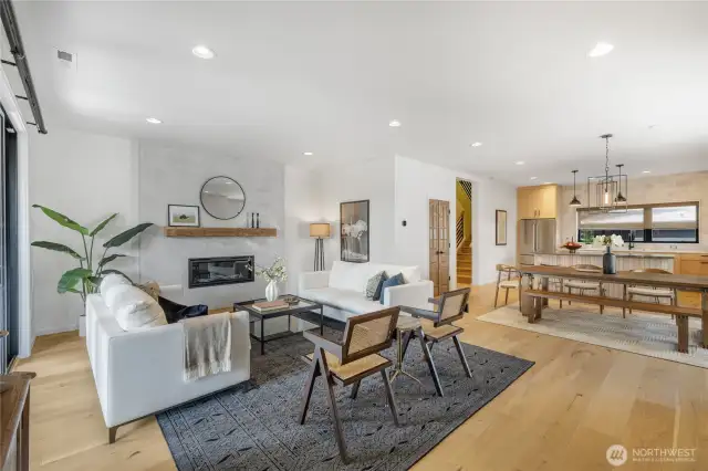 Comfortable living room complete with custom mantle-piece and convenient gas fireplace. Custom mantle piece. LED lighting. New interior paint.
