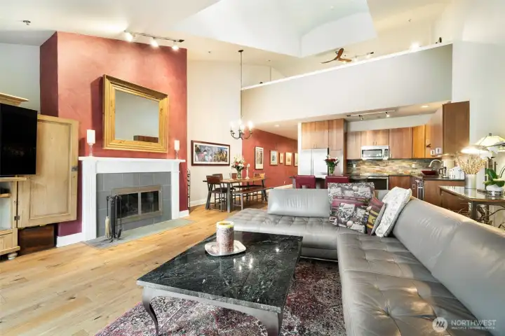 View of living room looking toward kitchen, dining room and hallway.