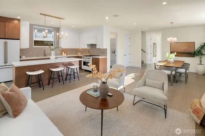 The kitchen blends the warmth of wood with the white/gold appliances. Designed for open entertaining, the kitchen island is expansive.