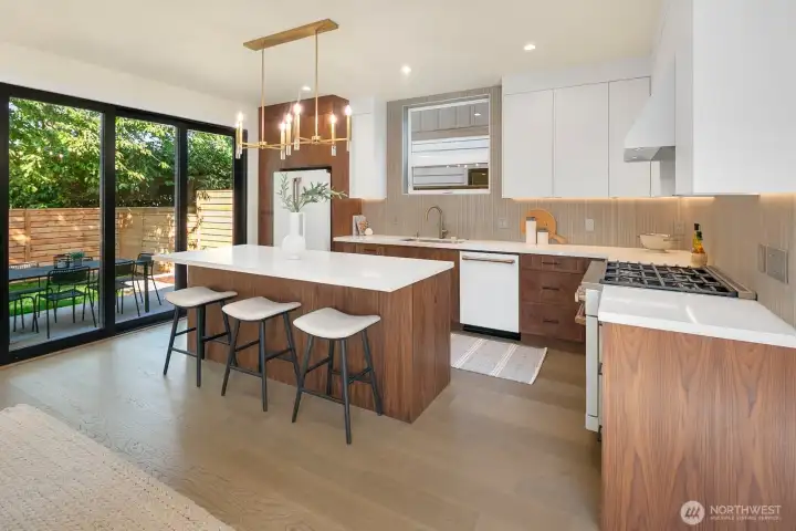 The sliding glass "wall" really opens up the space in the living area. Seamless transition to more "livable" space in the warmer months.