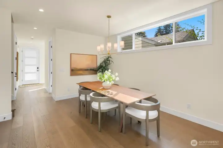 The door at the back of this photo is the main entrance with "mudroom" area. There's a powder room just off of the dining area.