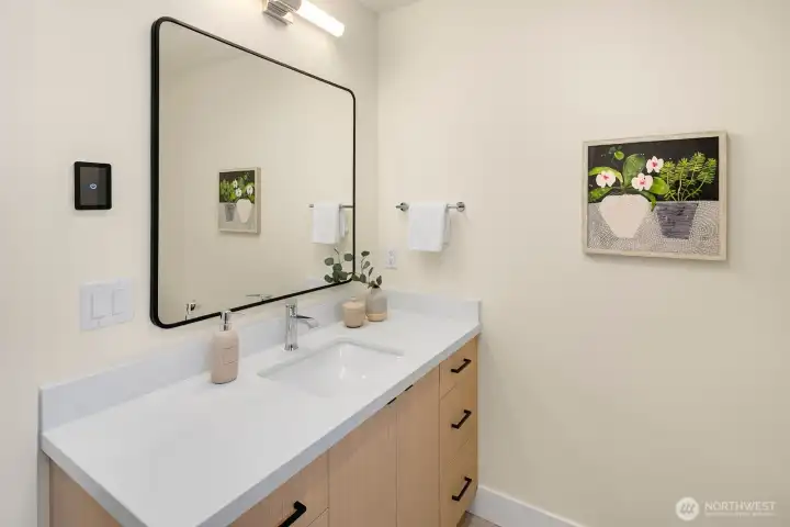 The 2 additional bedrooms on the second level share this full bath.