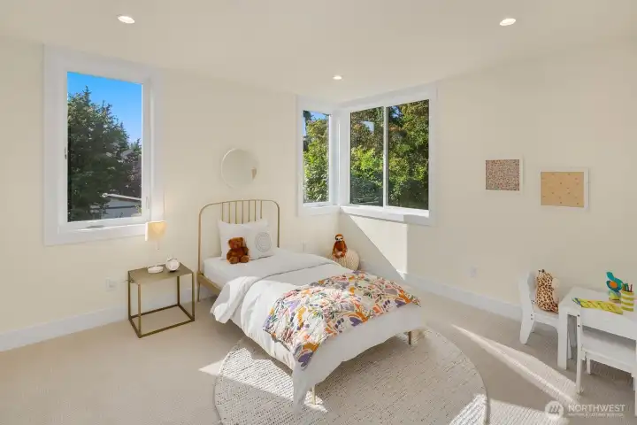 One of two additional bedrooms on the second level of the home.