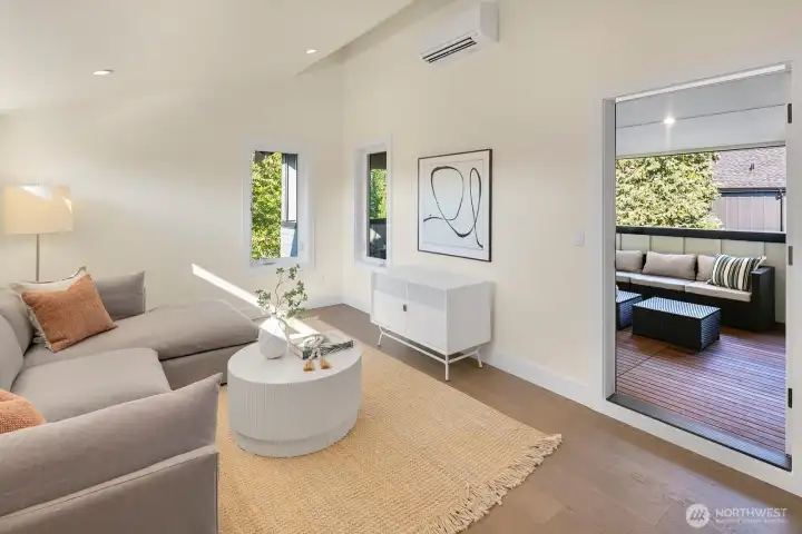 This shows the access to the covered deck area from the family room on the top level of the home.