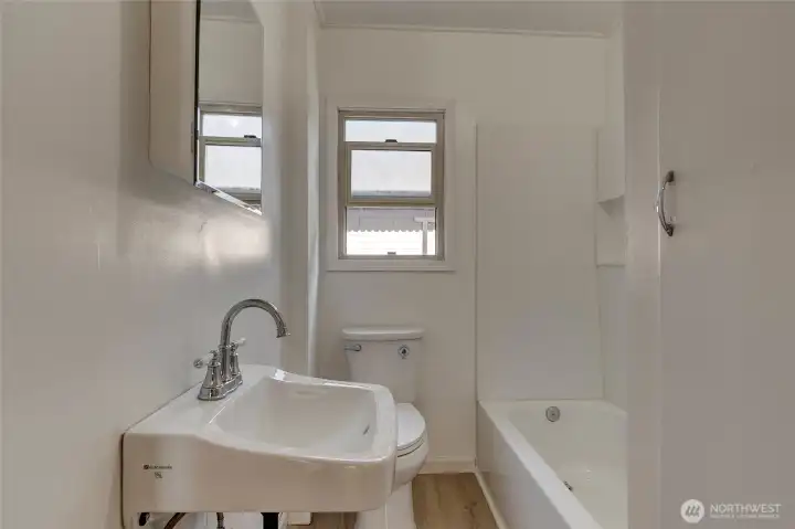 unit 102 remodeled bathroom with shower & tub