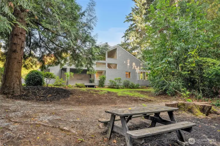 Just steps away from the deck is a rustic path into the deep, wooded neighborhood open space