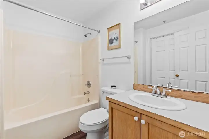Main bathroom with extra door access to 2nd bedroom