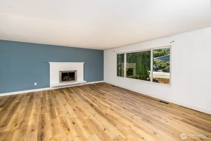 Renovated living room with wood burning fire place