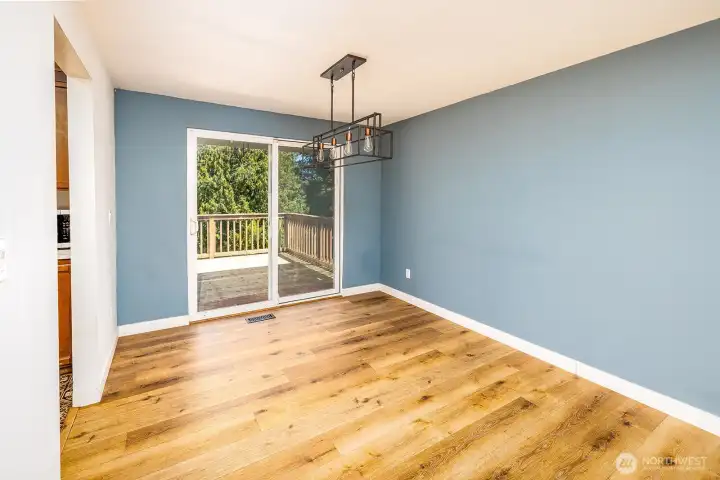 Dining area with kitchen and deck access