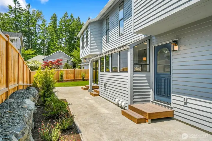 A spacious south facing patio off the kitchen and great room provides the perfect setting for entertaining and outdoor gatherings.
