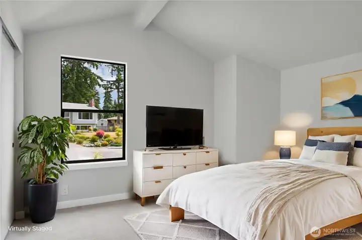 One of the upper level bedrooms with a vaulted ceiling and a secret room! Virtually staged.