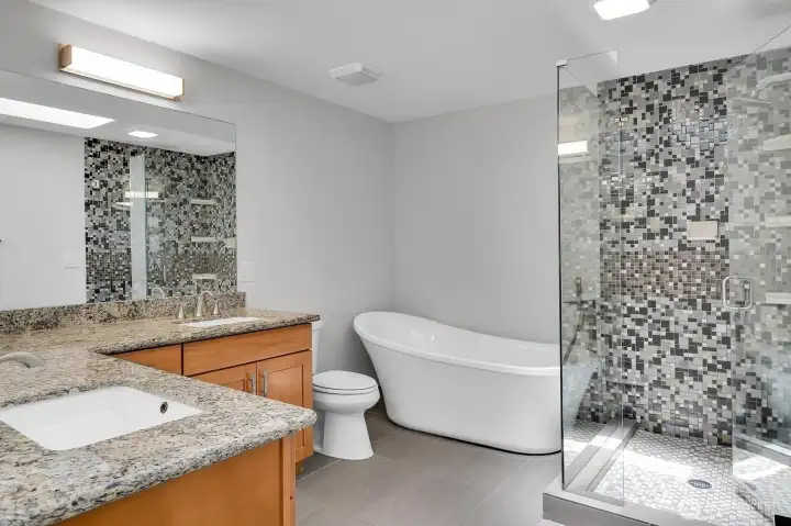 Guest bath with dual sinks, large soaking tub, heated tile floors, and a spacious walk-in shower!